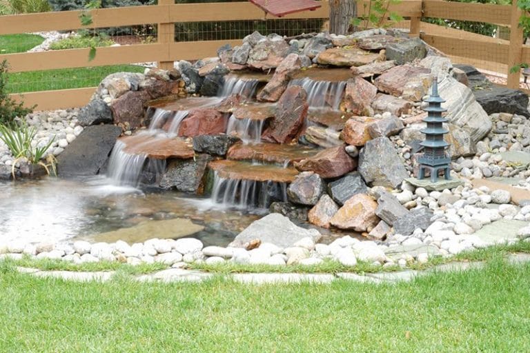 waterfall with pagoda statue